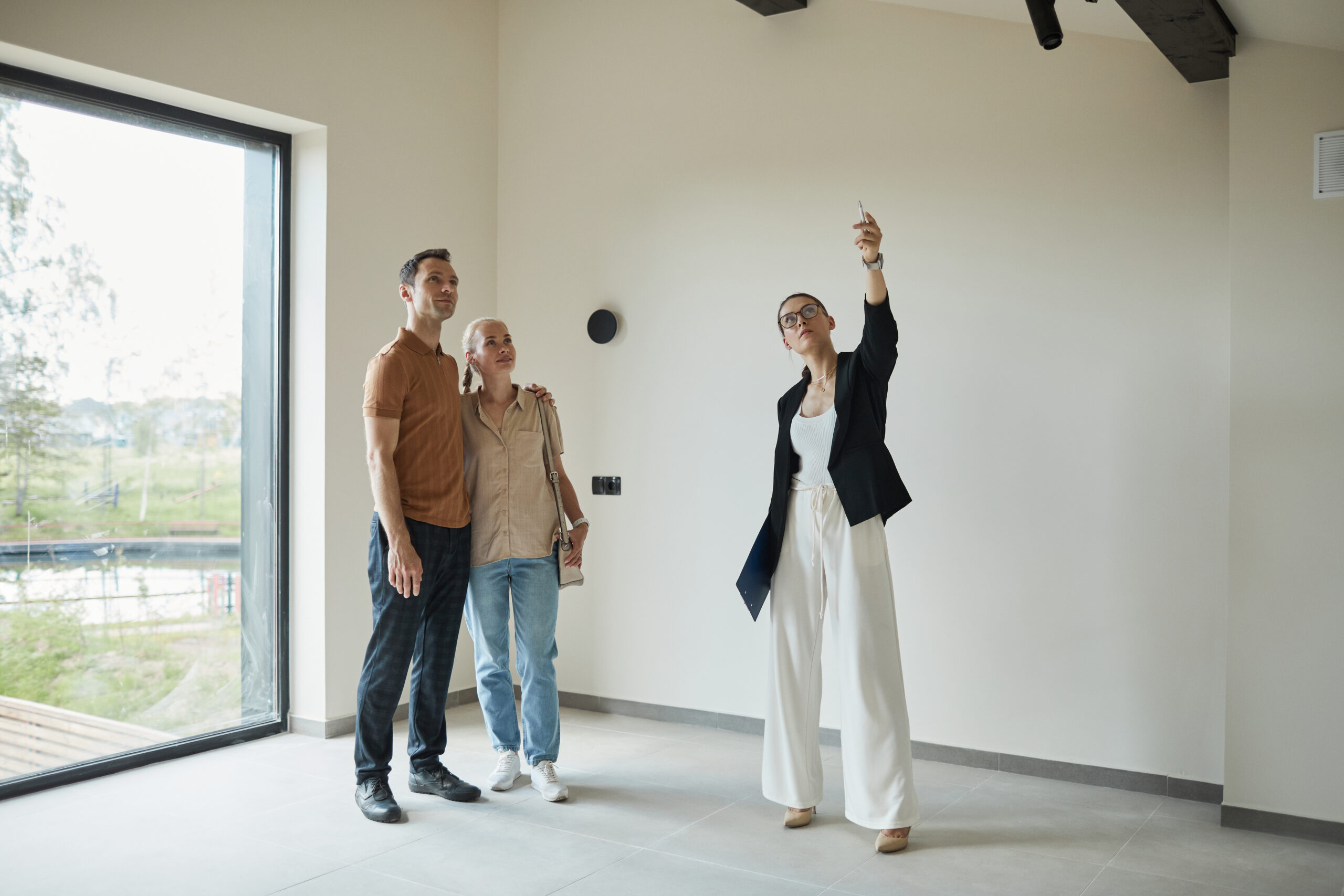 Couple looking into properties as a to-do on their buying a house in QLD checklist